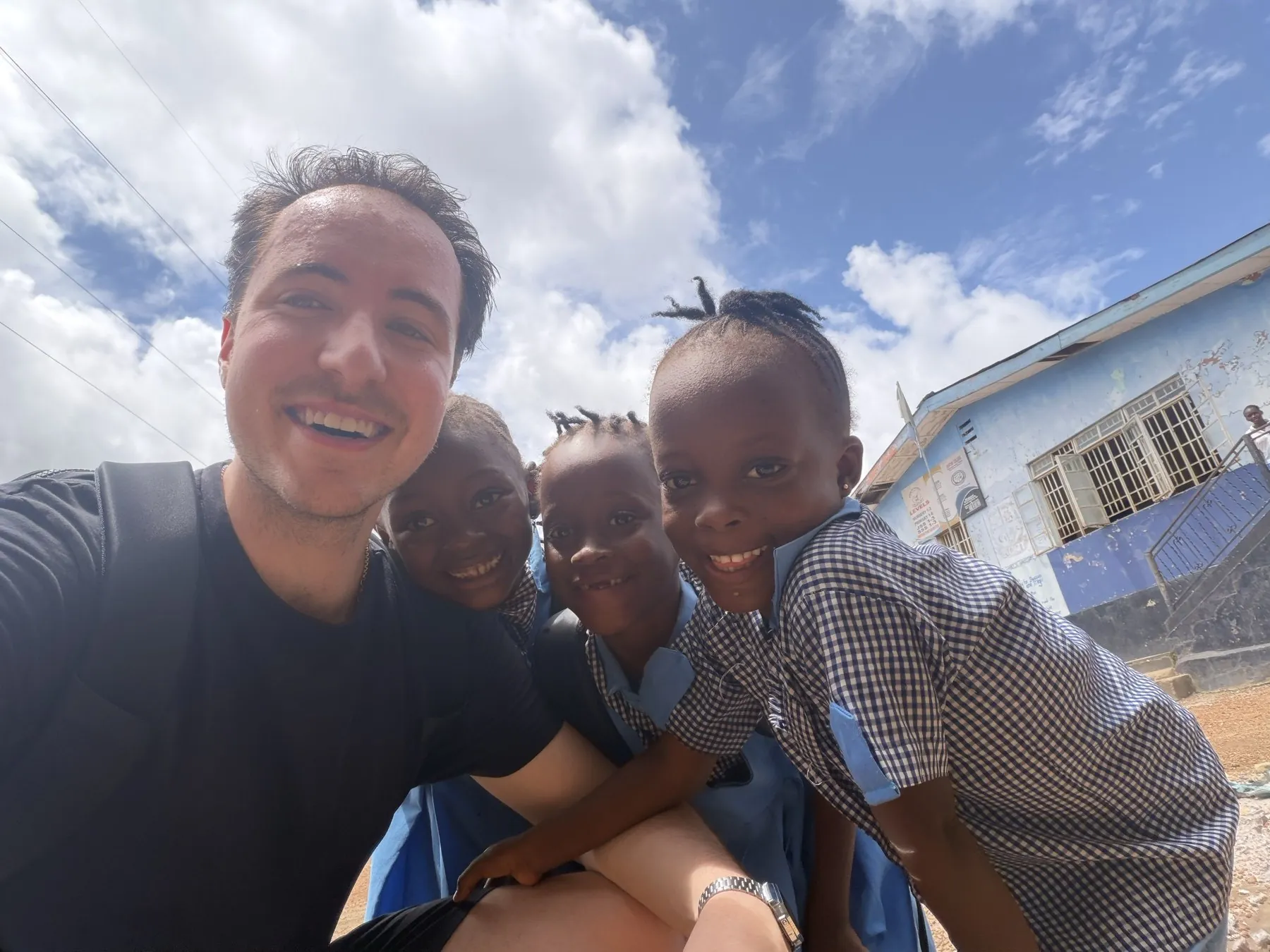 Capyo's founder with students at a partner school